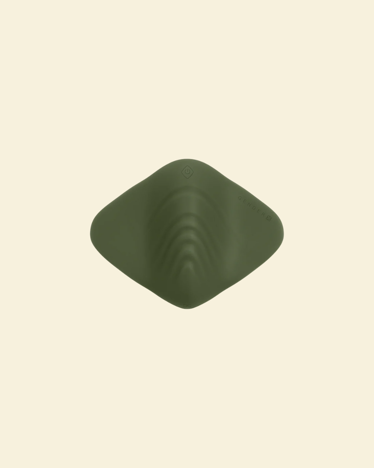 Top view of a green pleasure pad on a beige background