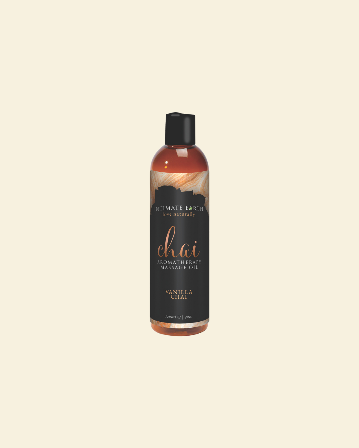 Bottle of Intimate Earth Chai Fragrance Massage Oil on a beige background