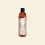 Bottle of intimate lubricant with strawberry flavor on a beige background