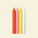 Four colorful drip candles on a beige background