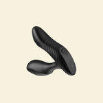 Black ribbed prostate massager on beige background