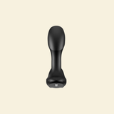 A matte black personal massager with a curved, ergonomic head and a wider base, shown from a side view against a solid cream-colored background.