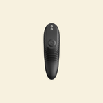 A black personal massager shown from the front against a solid cream-colored background.