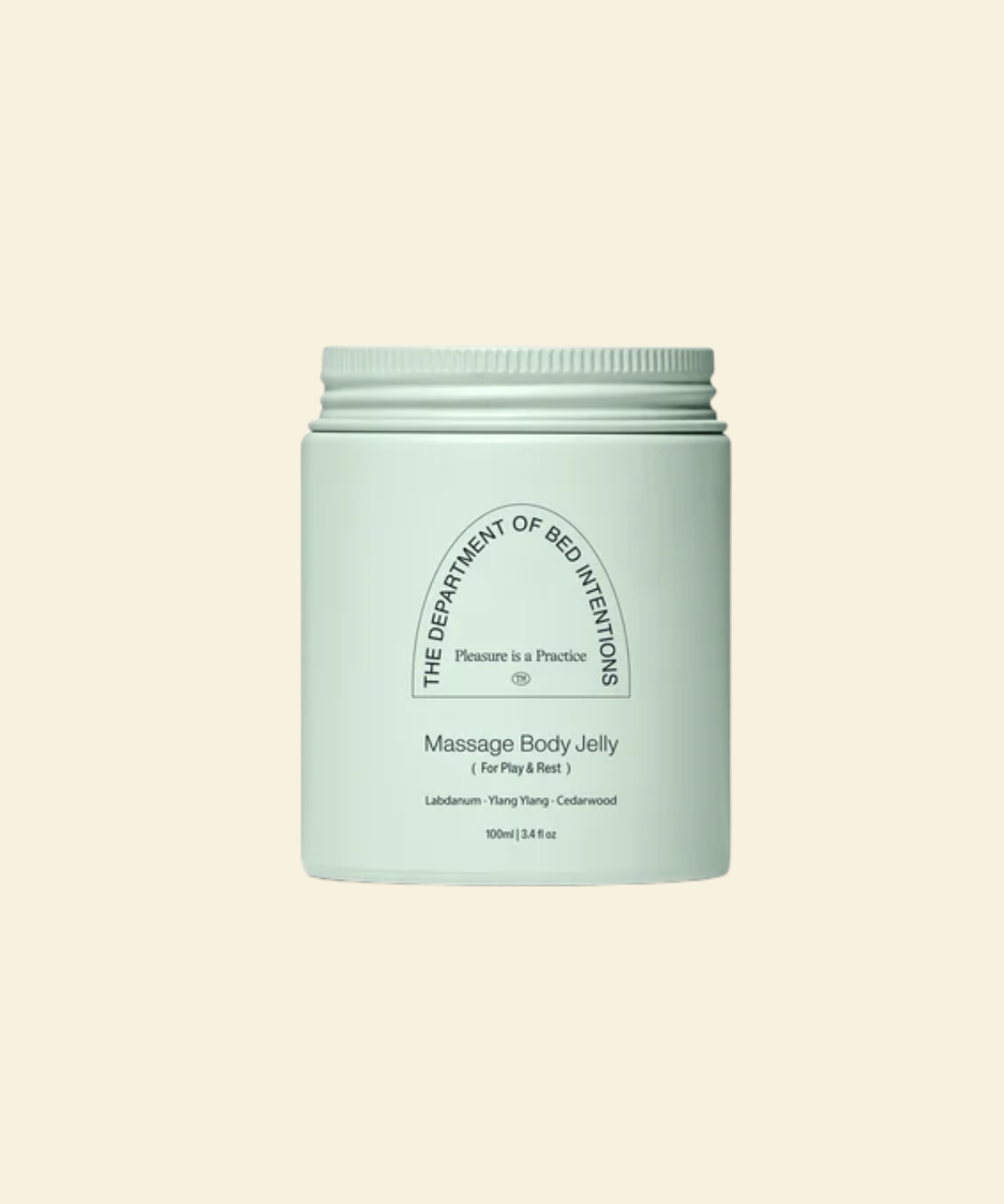 A mint green jar of 'The Department of Bed Inventions' Massage Body Jelly, centered on a solid cream background.