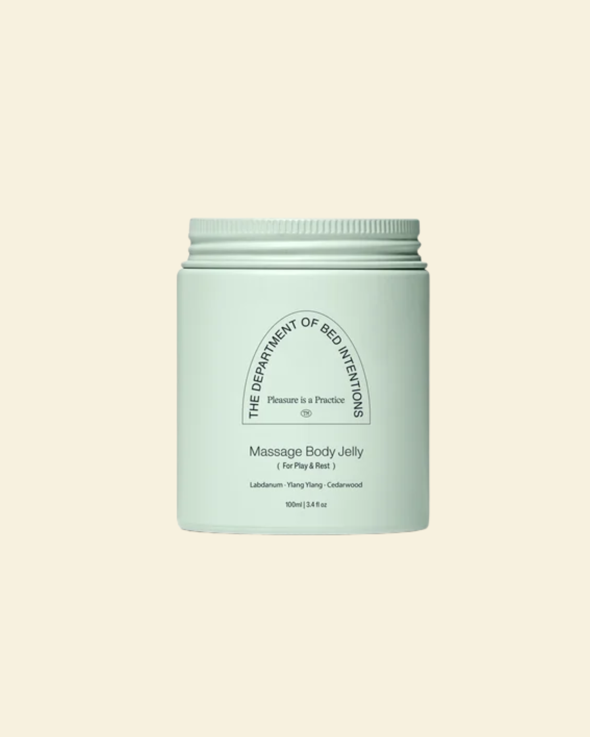 A mint green jar of 'The Department of Bed Inventions' Massage Body Jelly, centered on a solid cream background.