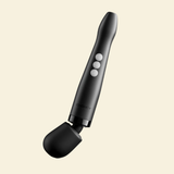 A black Doxy wand massager with three white buttons and a flexible black silicone attachment, shown against a solid pale cream background.