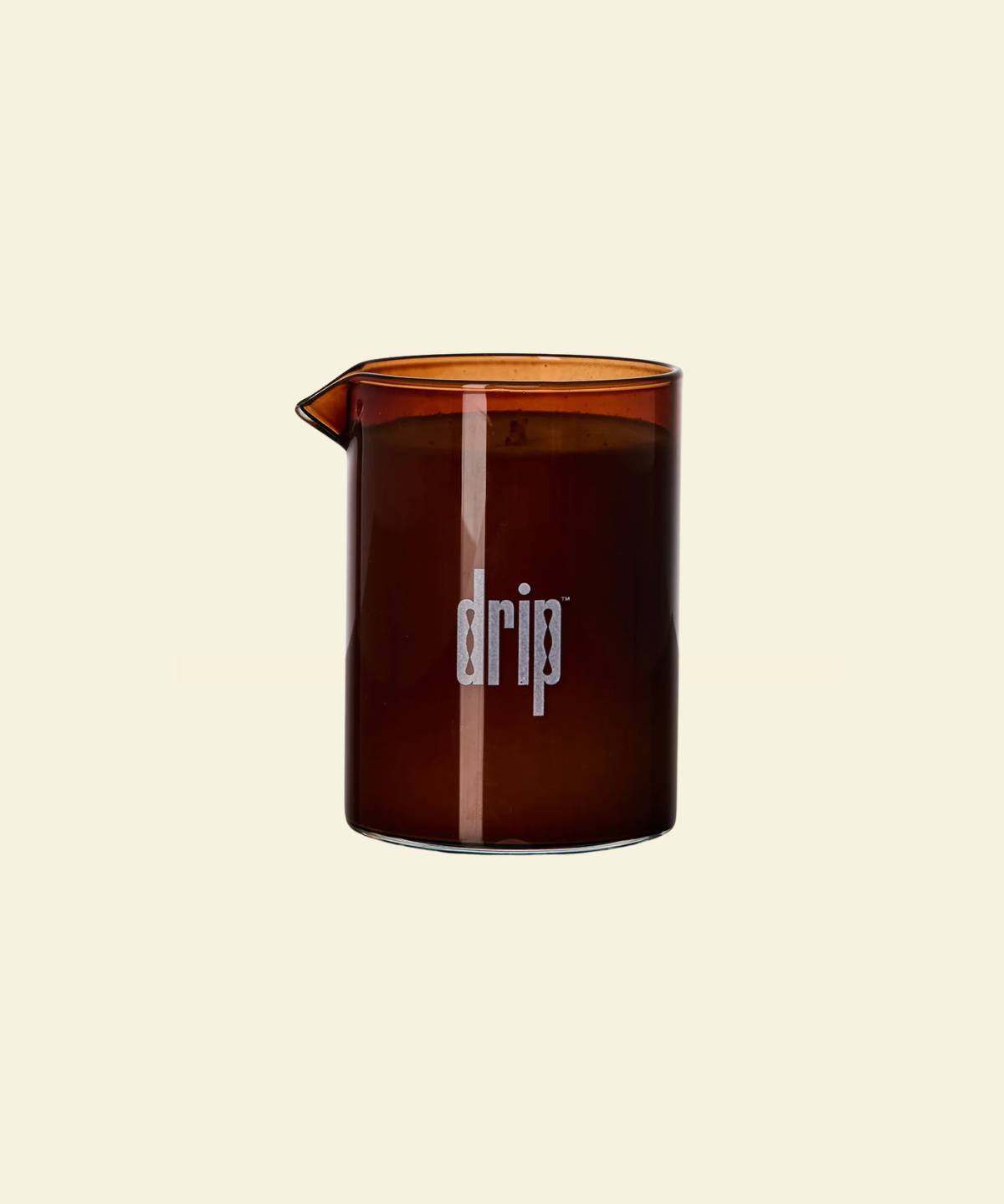 Brown glass vessel containing a drip massage candle