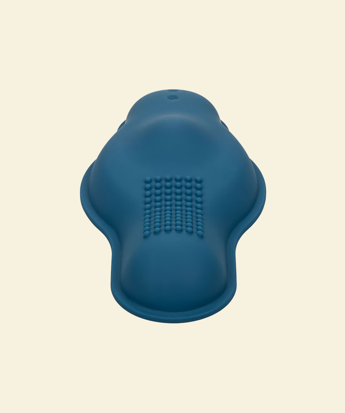 Blue vibrating grinder on beige background