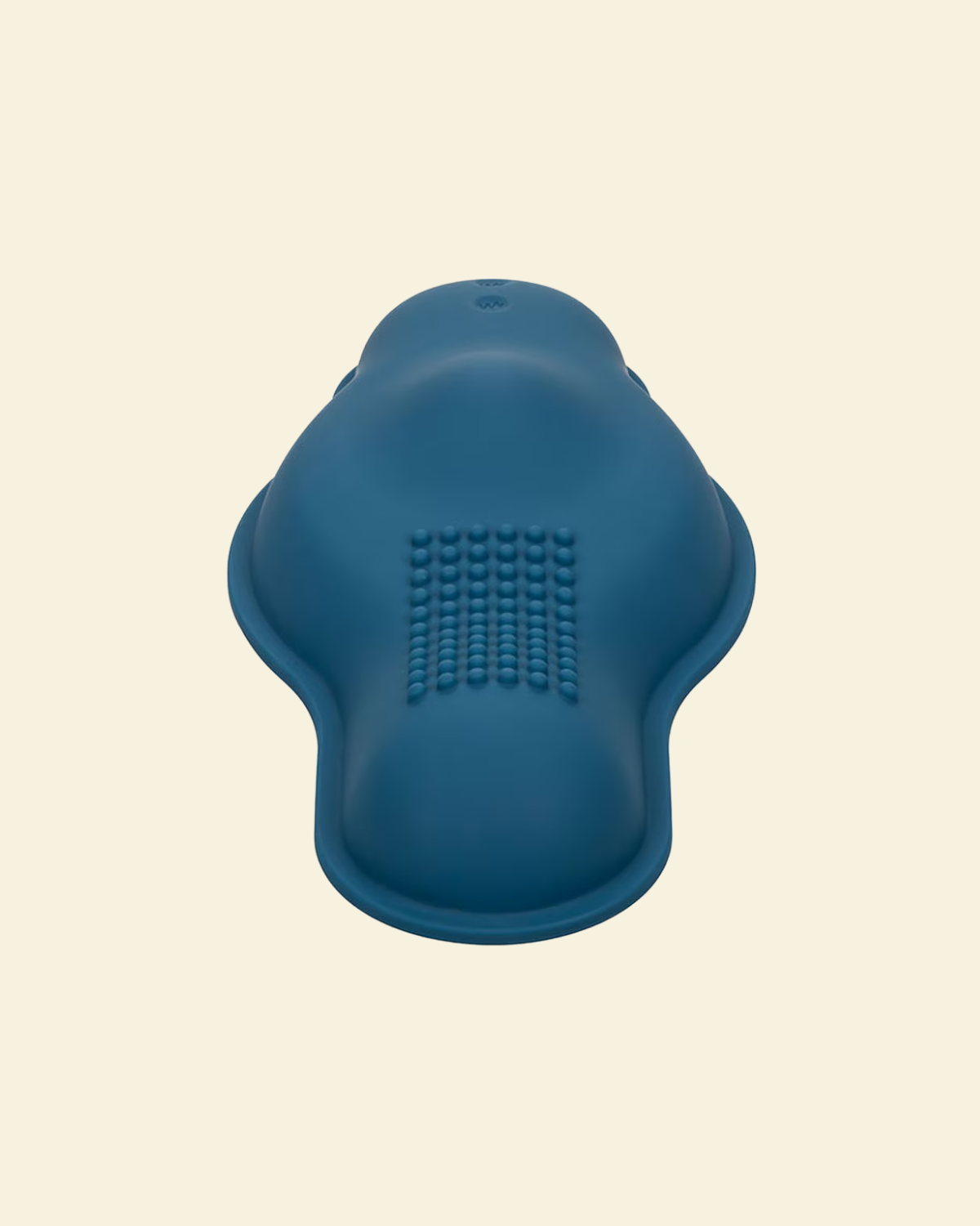 Blue vibrating grinder on beige background