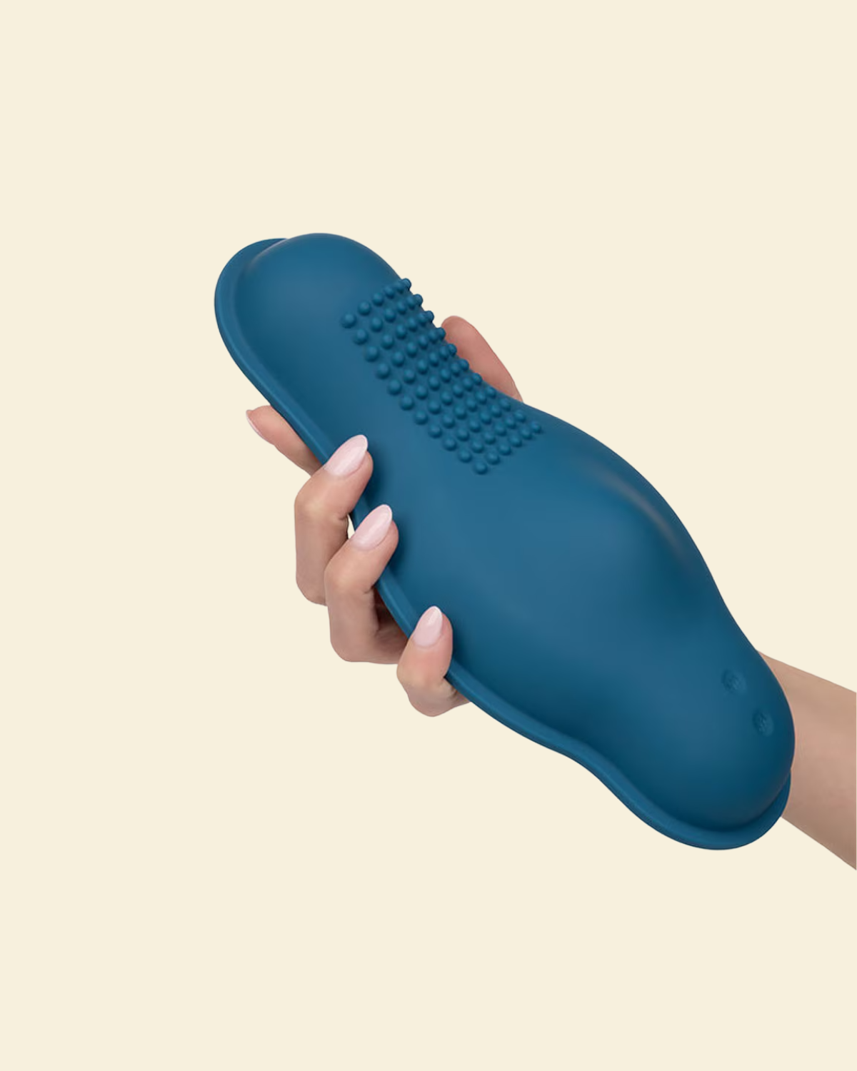 Hand holding a blue silicone vibrator 