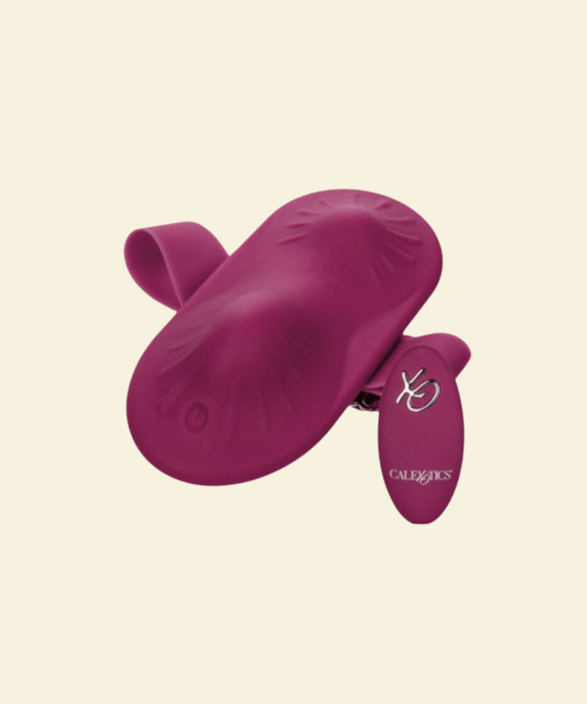 A magenta silicone intimate accessory with a main curved body, a smaller attached flap, and a small white logo and brand name reading CalExotics, shown on a plain warm cream background.