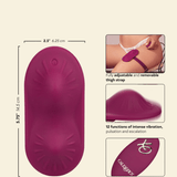 A product infographic for a magenta thigh strap vibrator on a light beige background. The main panel shows the product with dimensions labeled. 