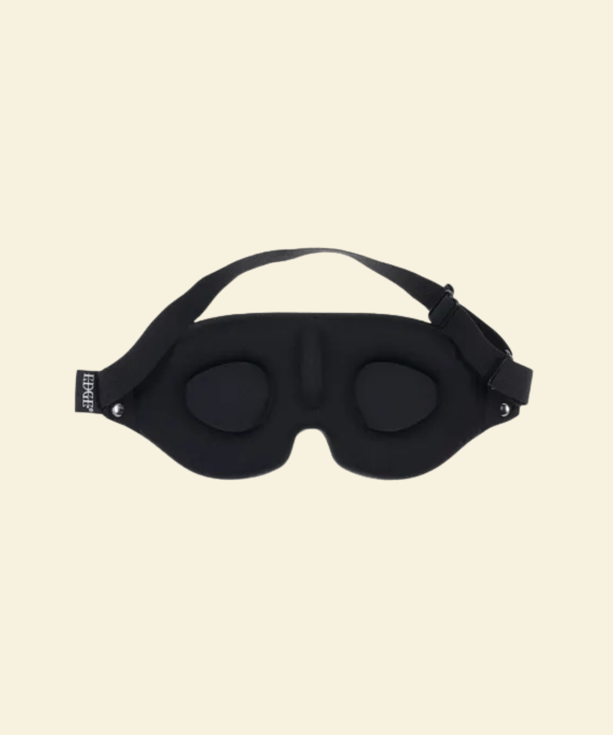 Black sleep mask on a beige background - High Tide Adult Store