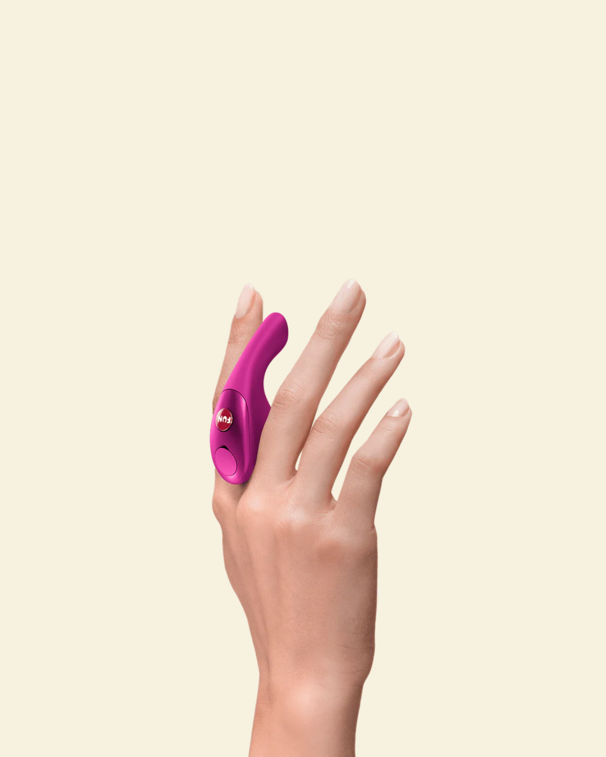 Hand holding a magenta finger vibrator between fingers