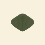 View of the bottom of a green pleasure pad on a beige background