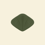View of the bottom of a green pleasure pad on a beige background