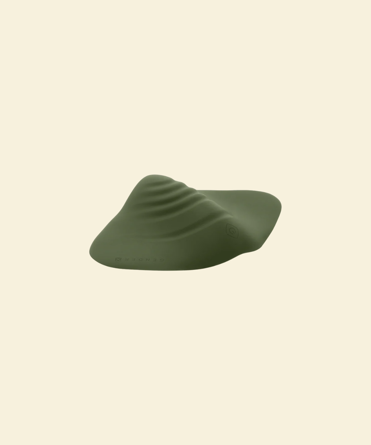 Green pleasure pad on a beige background