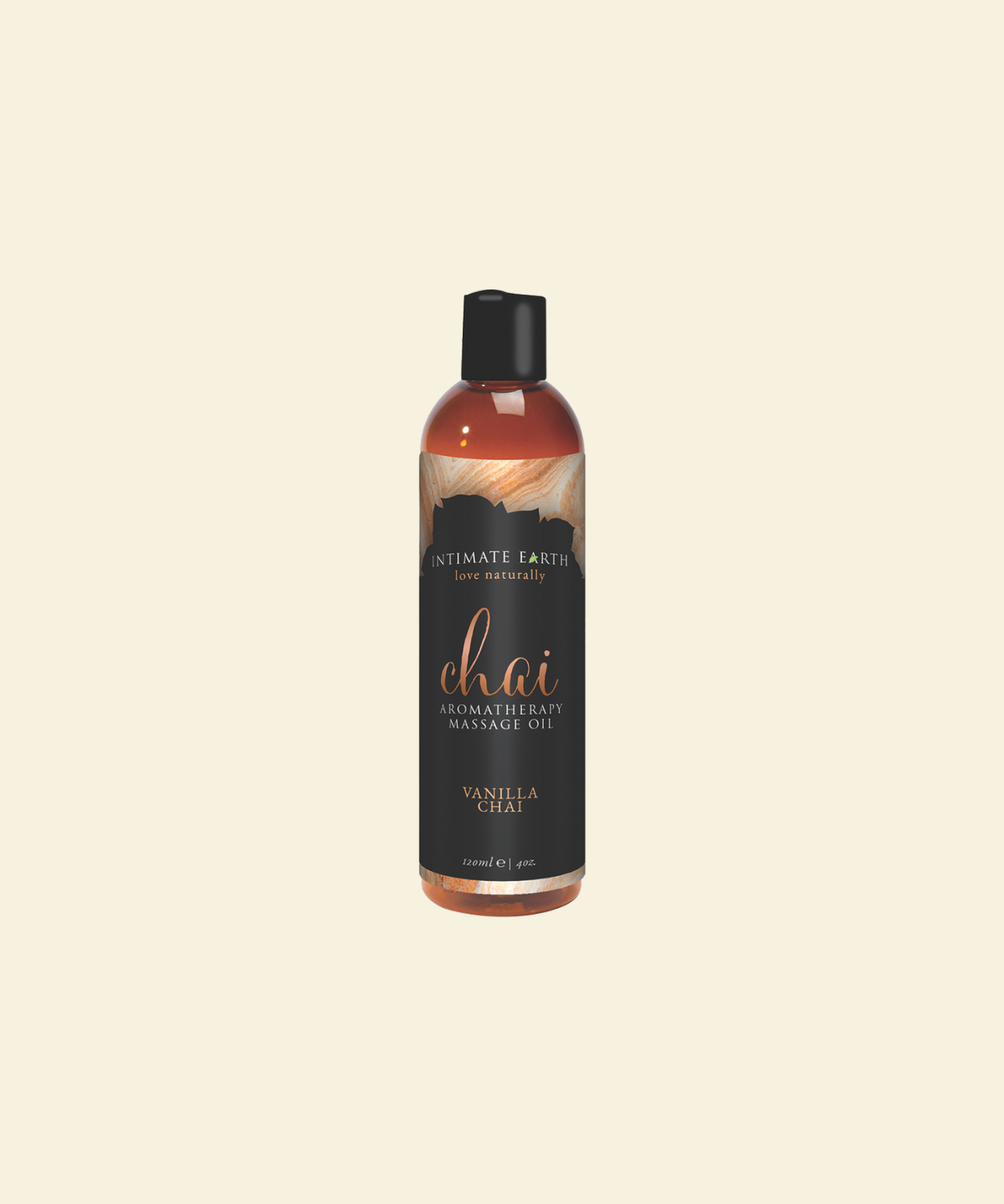 Bottle of Intimate Earth Chai Fragrance Massage Oil on a beige background