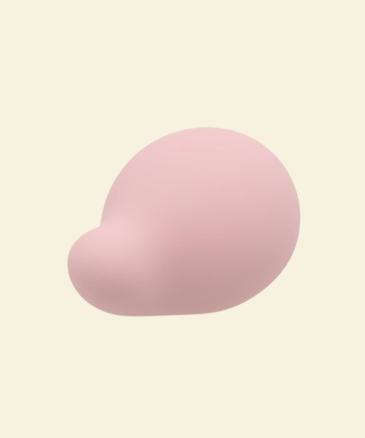 A soft pink palm vibrator on a beige background