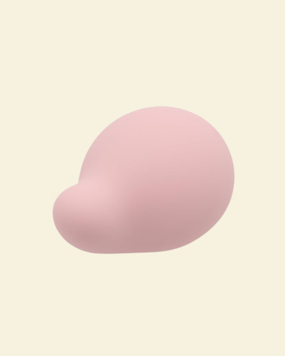 A soft pink palm vibrator on a beige background