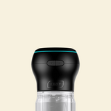 The top of a black and clear suction and stroking masturbator