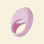 Pink silicone ring with 'LELO' branding on a light beige background