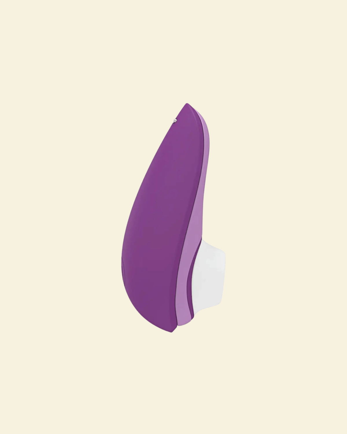 Purple Womanizer Air suction toy on beige background - side view