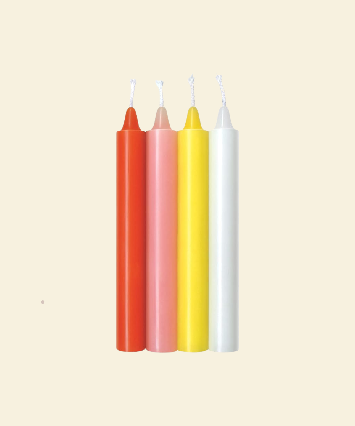 Four colorful drip candles on a beige background