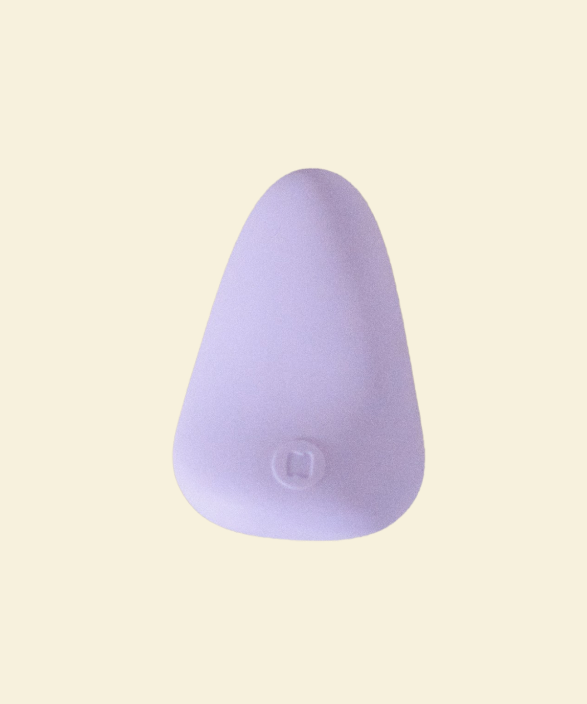 Purple silicone palm vibrator on a  beige back ground