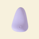 Purple silicone palm vibrator on a  beige back ground