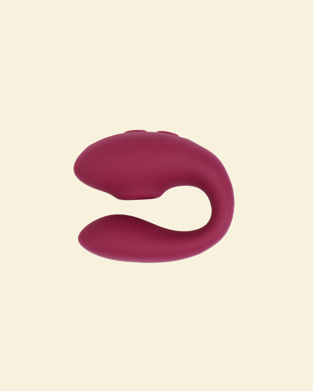 Plum colored blended stimulation vibrator on a beige background