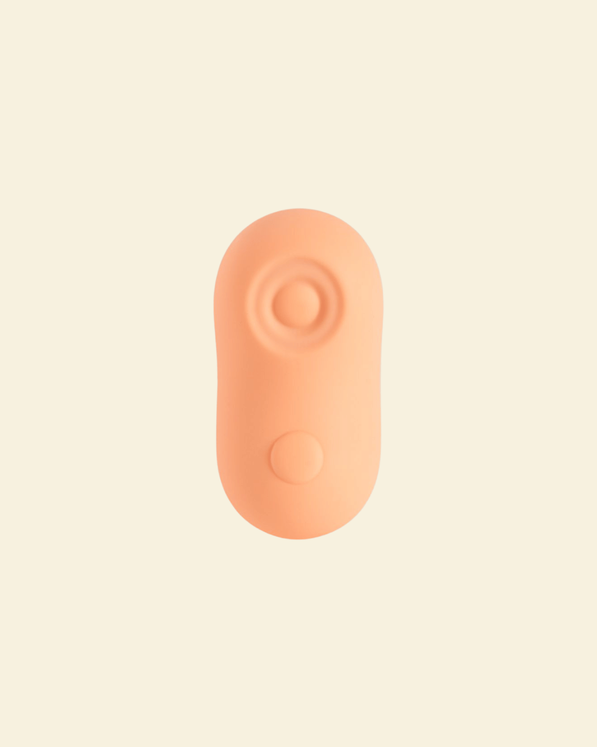 A coral colored tapping and vibrating massager 