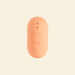 the backside of a coral colored tapping and vibrating massager, showing two buttons