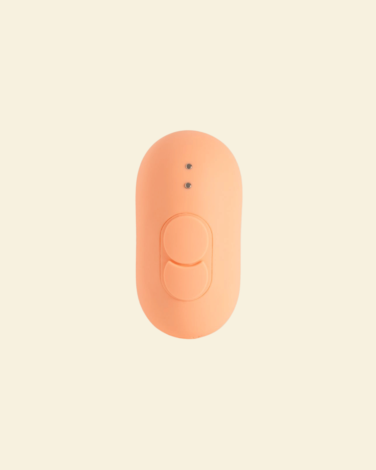 the backside of a coral colored tapping and vibrating massager, showing two buttons