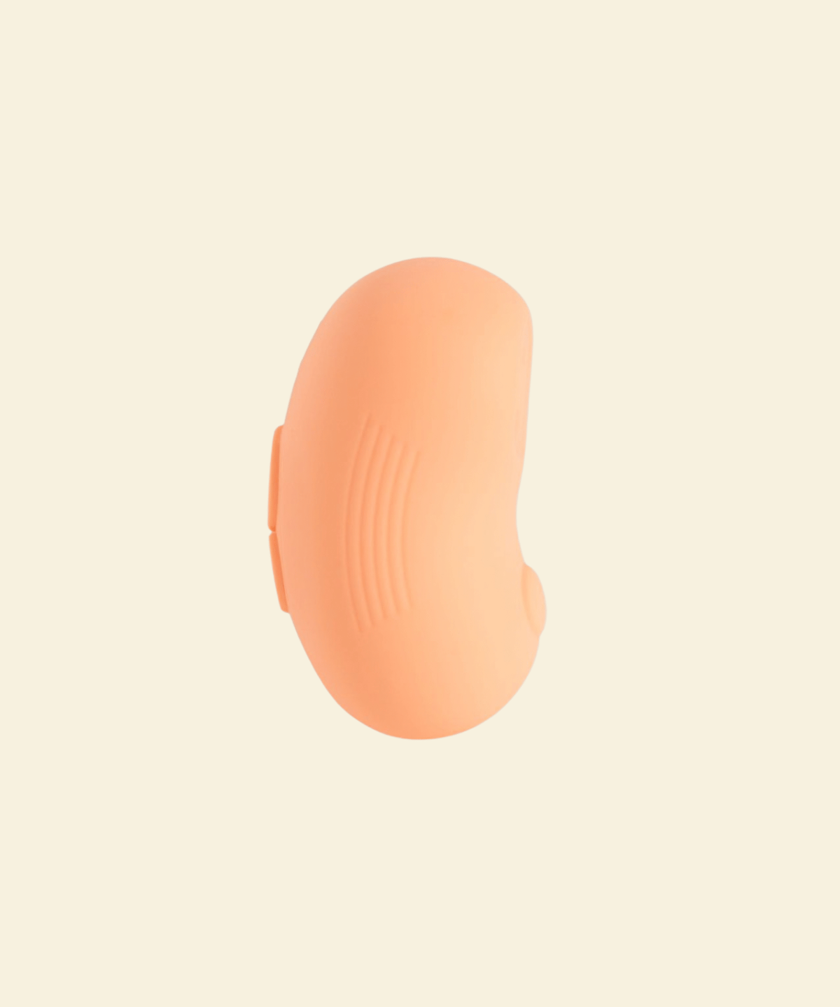 Side view of a coral colored tapping and vibrating massager 
