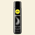 Bottle of pjur Original lubricant on a beige background