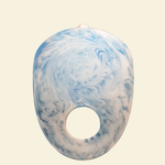 Blue and white marbled object on a beige background