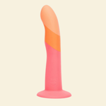 Two-toned pink and orange dildo on a beige background