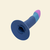 Blue and purple silicone dildo on a beige background