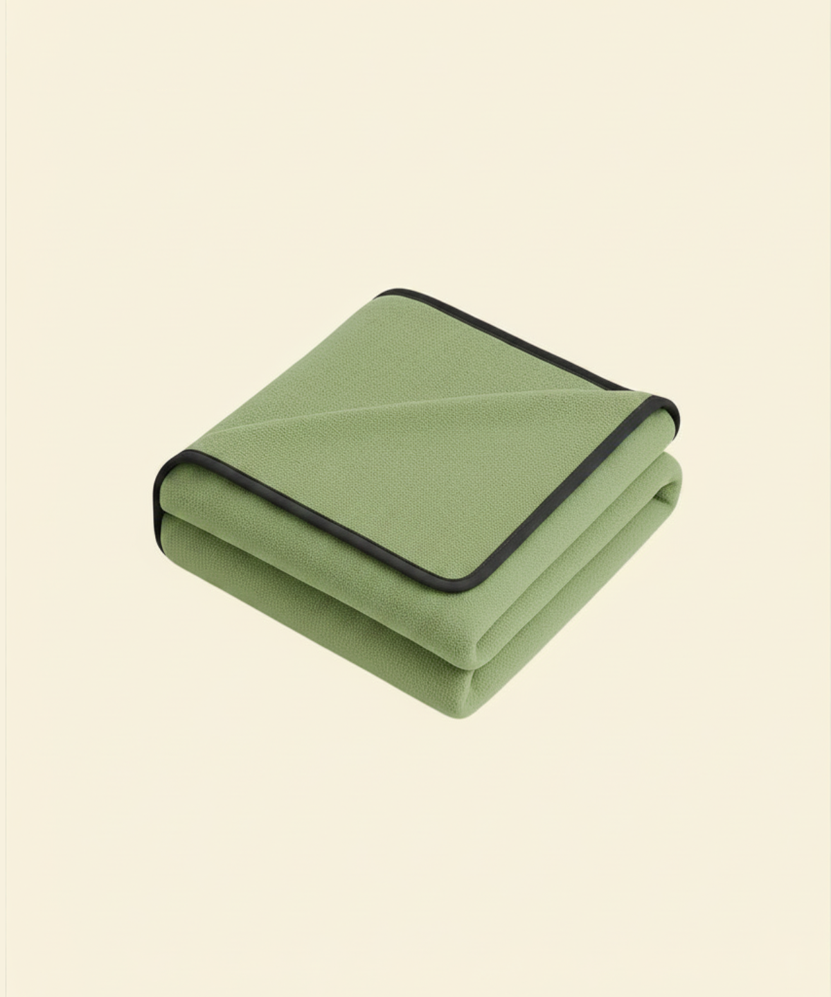 Folded matcha green waterproof blanket with black trim on a beige background