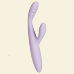 Lilac coloured rabbit vibrator on a beige background