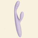 Lilac coloured rabbit vibrator on a beige background