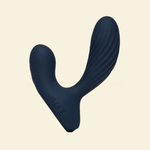 Navy blue prostate massager on beige background