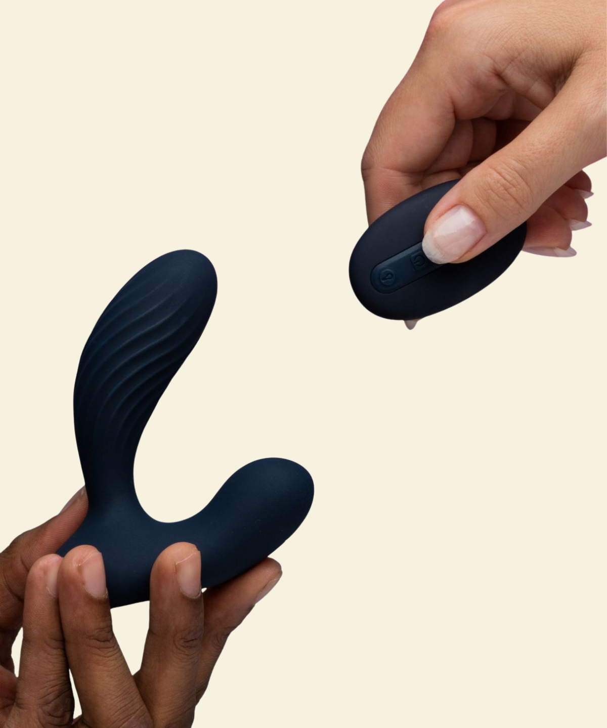 Hands holding navy blue prostate massager