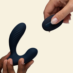 Hands holding navy blue prostate massager