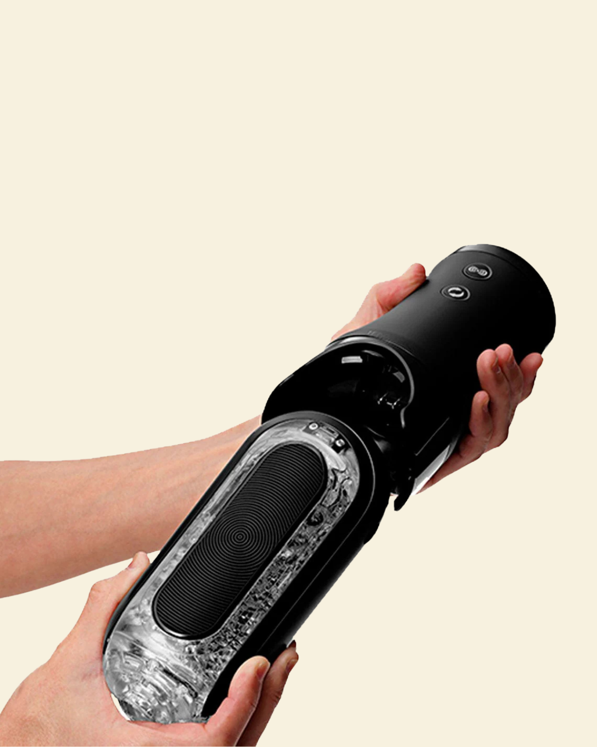 Black vibrating stroker held by a person against a beige background
