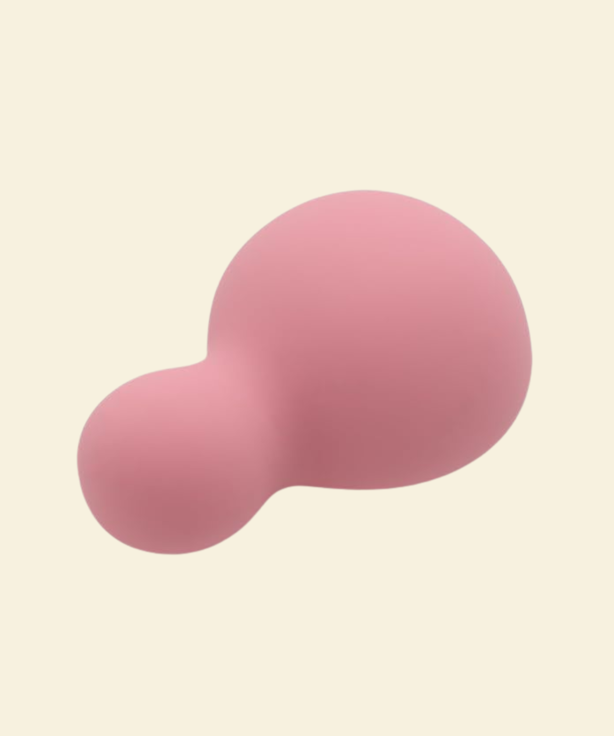 a small pink and soft palm vibrator on a beige background