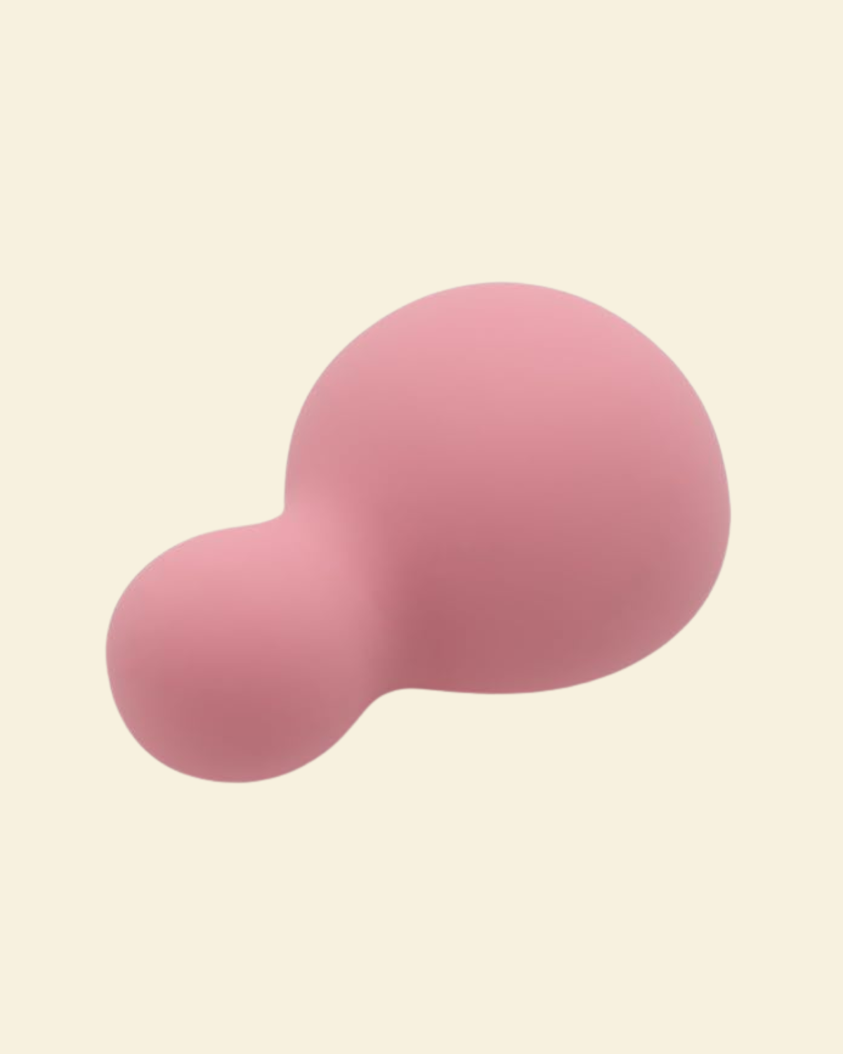 a small pink and soft palm vibrator on a beige background