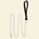Leash made from stainless steel and genuine leather on a beige background