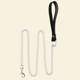 Leash made from stainless steel and genuine leather on a beige background